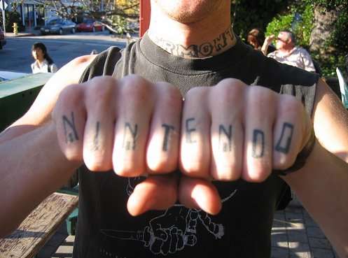 looking Nintendo art logo tattoos besides the Super Mario Bros Tattoos